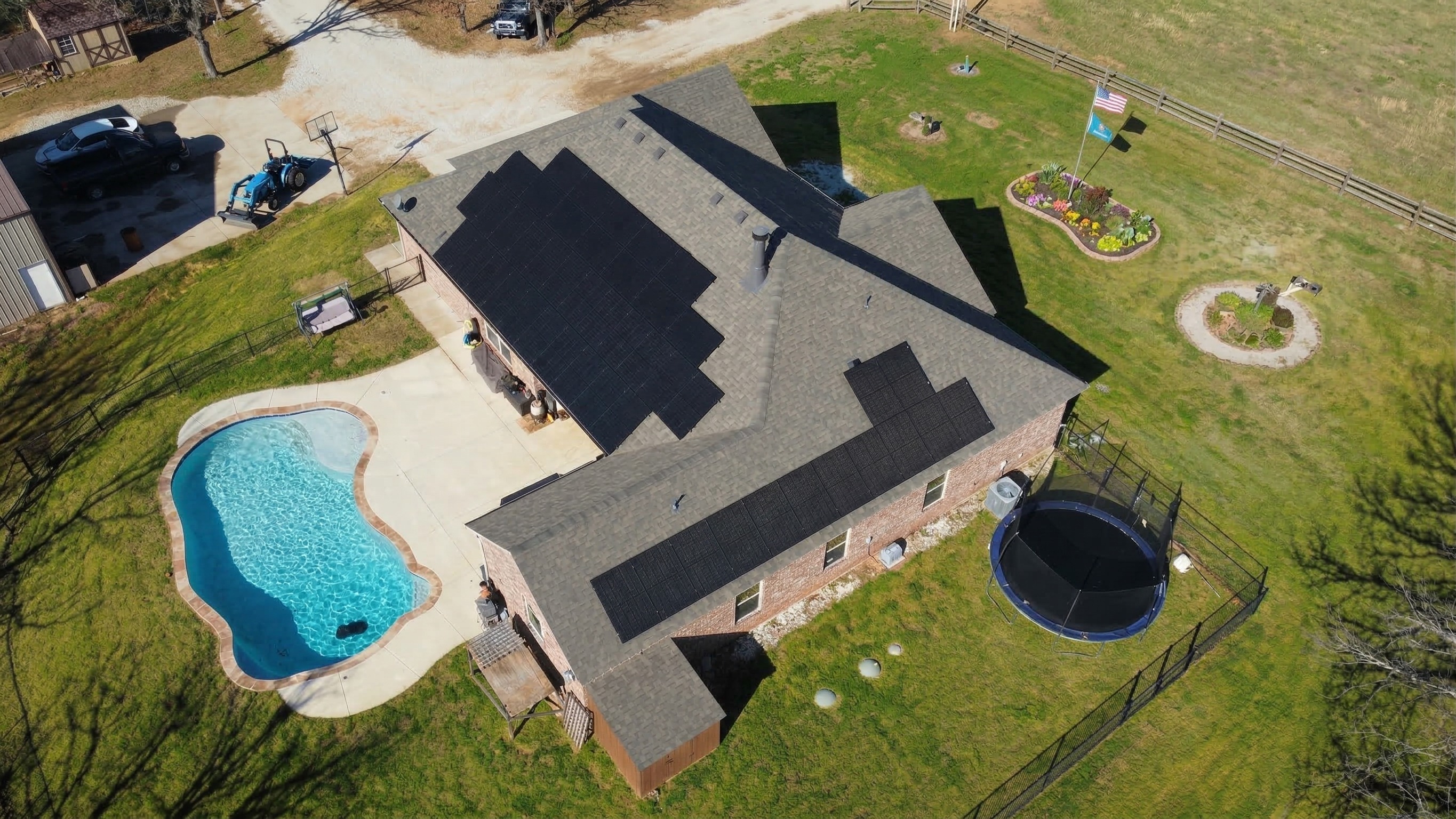 Rural Oklahoma home with solar array, pool and American flag