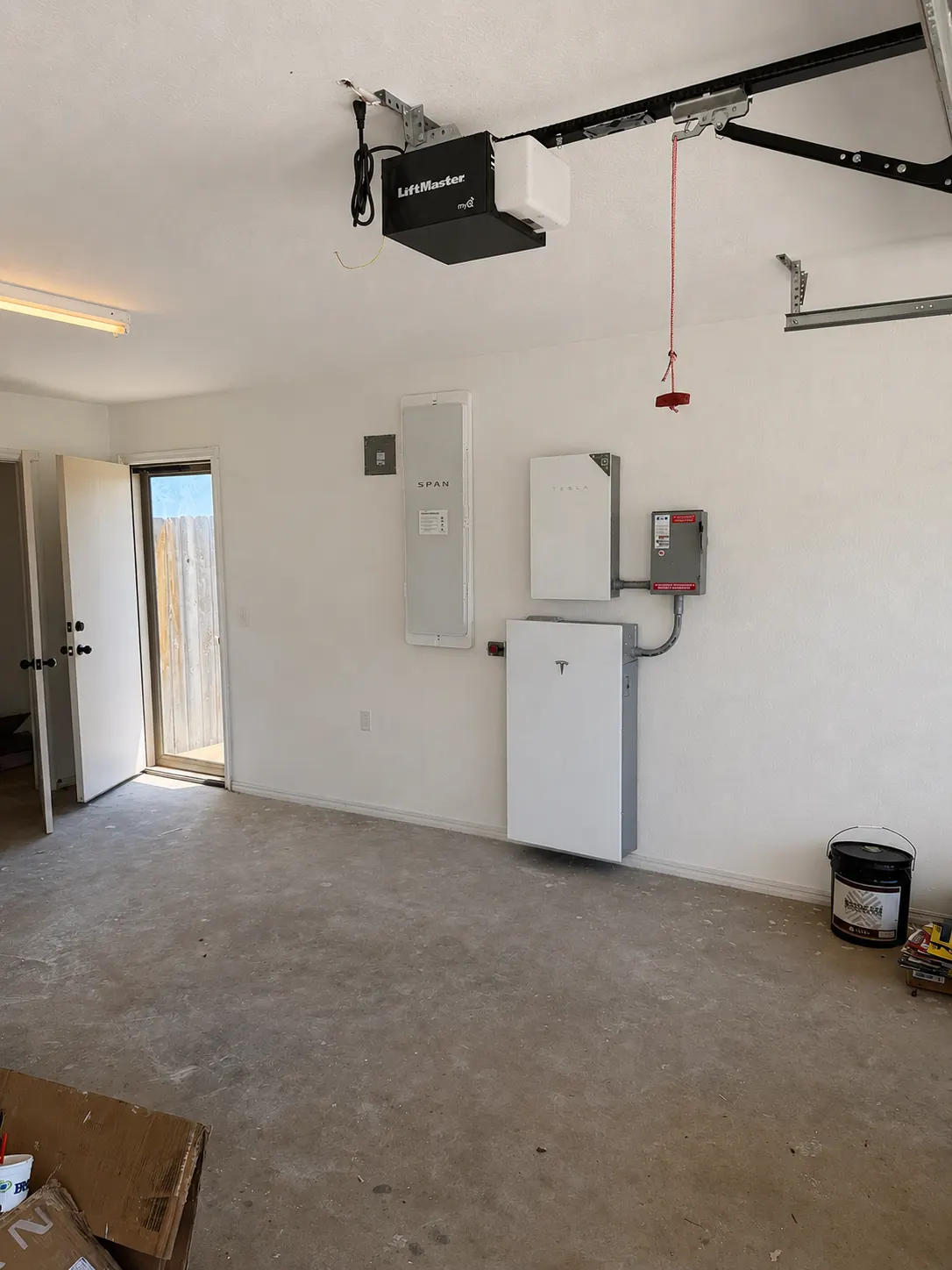 SPAN smart electrical panel and Tesla Powerwall 3 installed in an Amber, Oklahoma garage